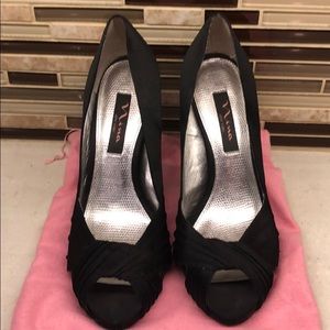 Black satin peep toe pumps